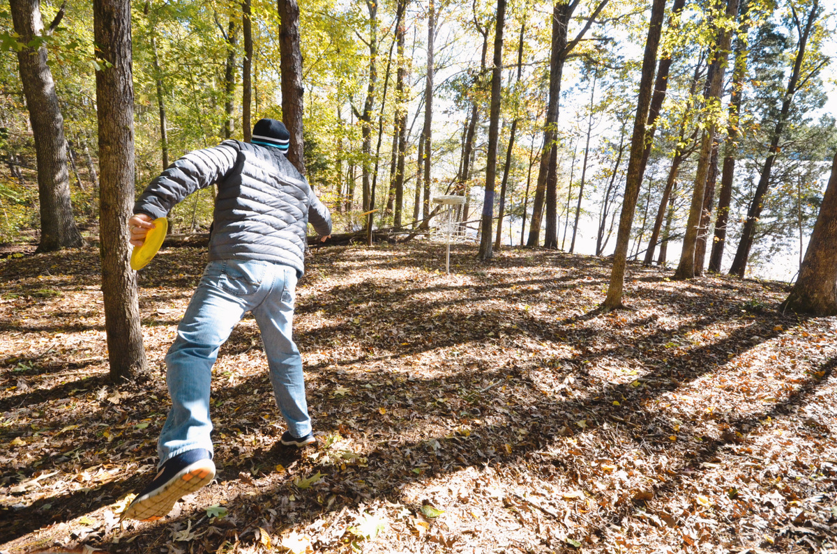 Disc golf in a wooded setting